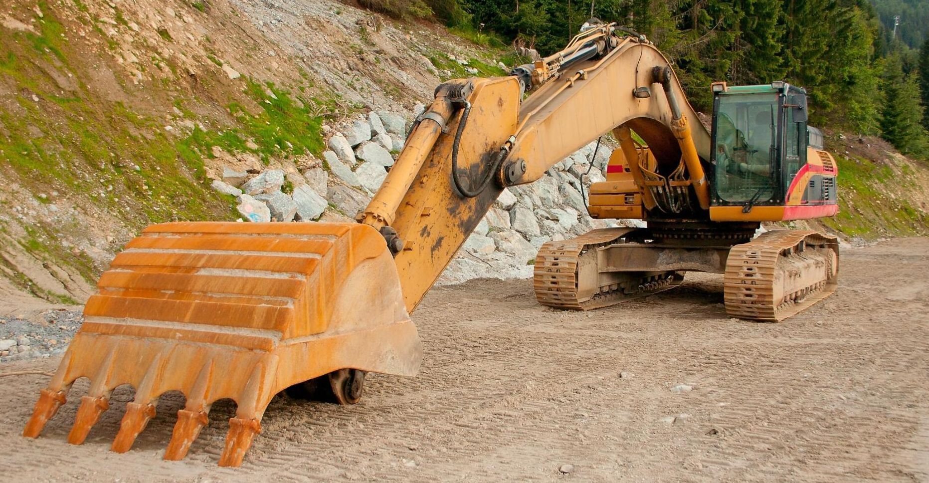 excavator grading raw land