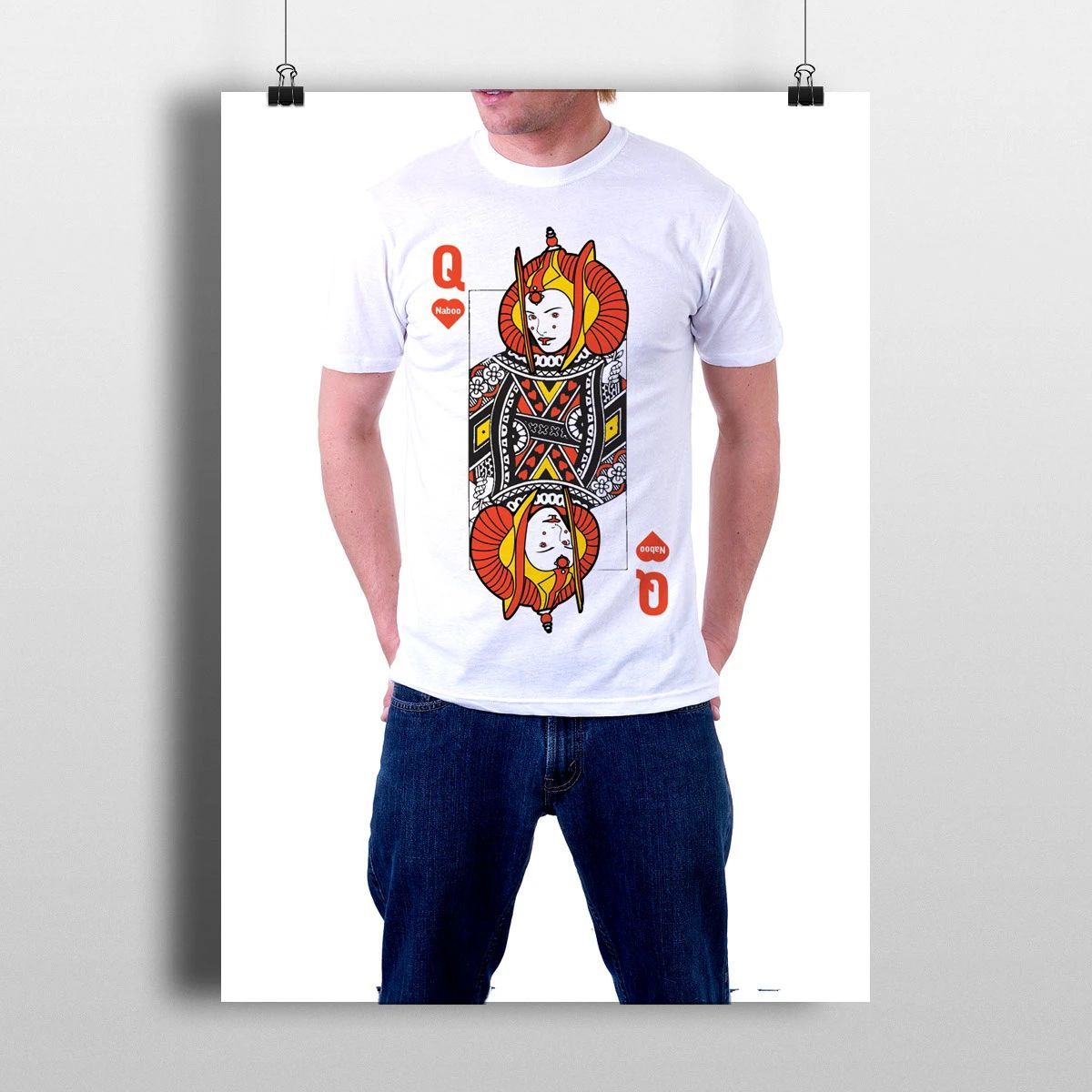 Person wearing a white T-shirt with a colorful queen playing-card graphic and blue jeans