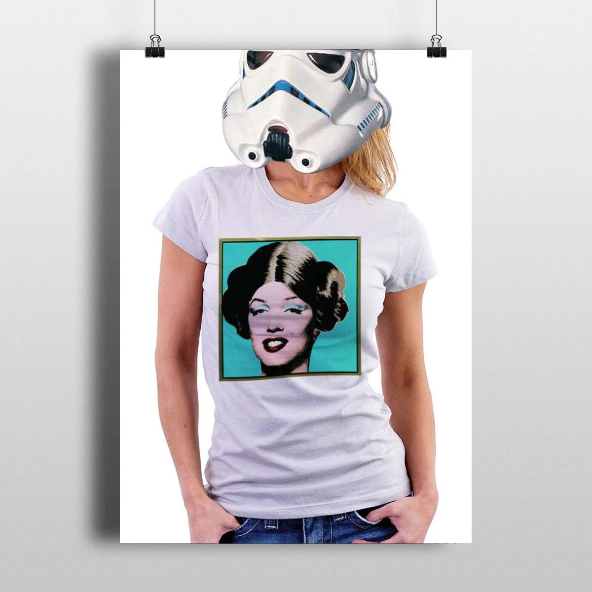Person in a white sci-fi helmet wearing a gray T-shirt with a pop-art portrait print.