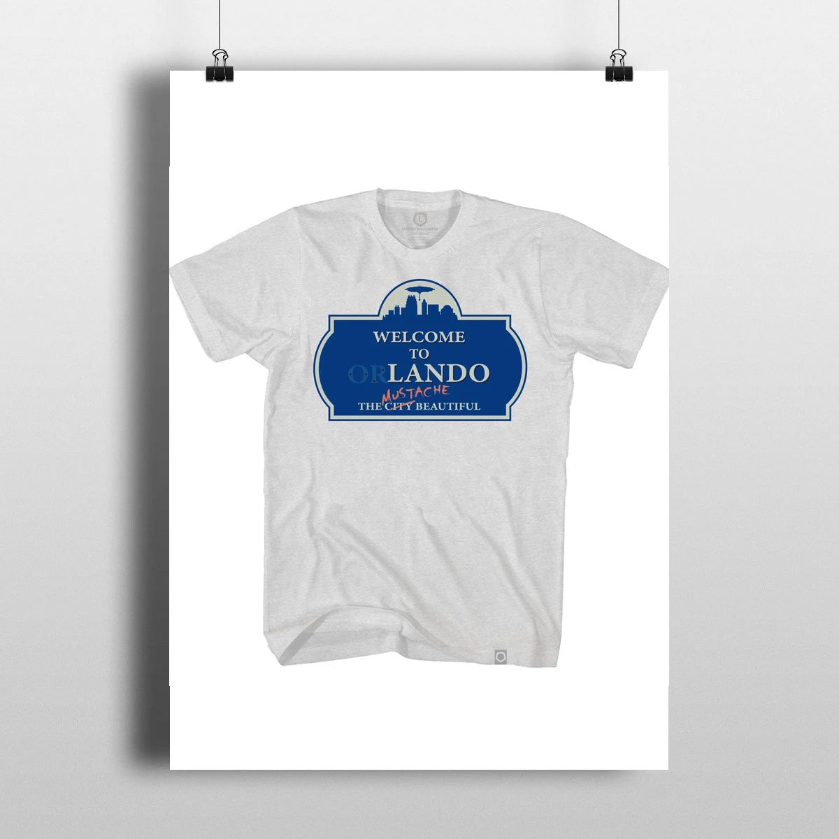 White T-shirt with a blue “Wicked Orlando” graphic on a hanger