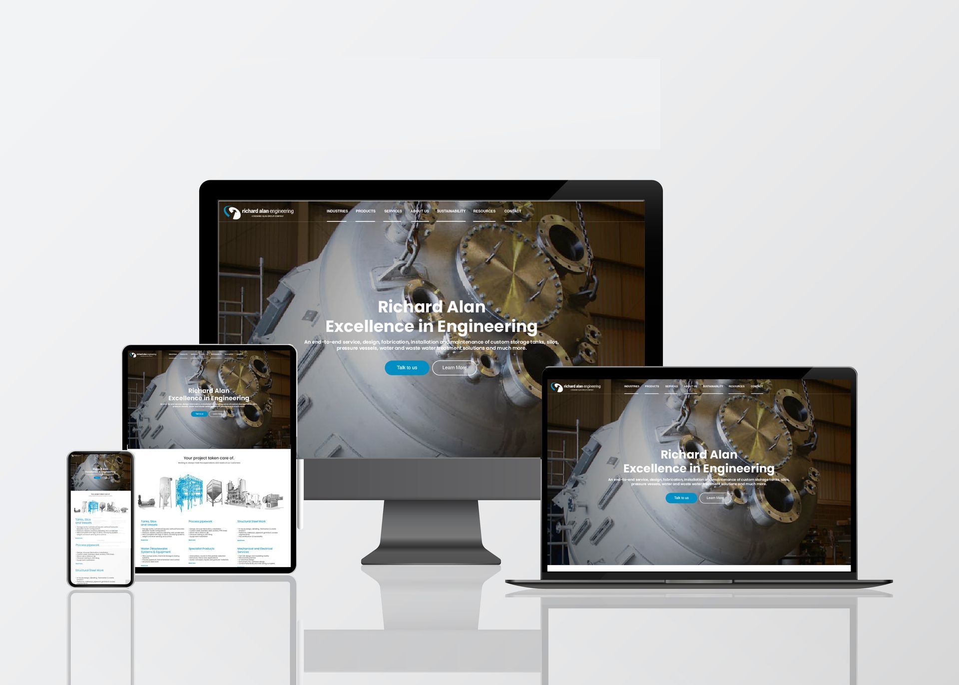 Responsive website shown on desktop, laptop, tablet, and phone screens with a gear-themed background
