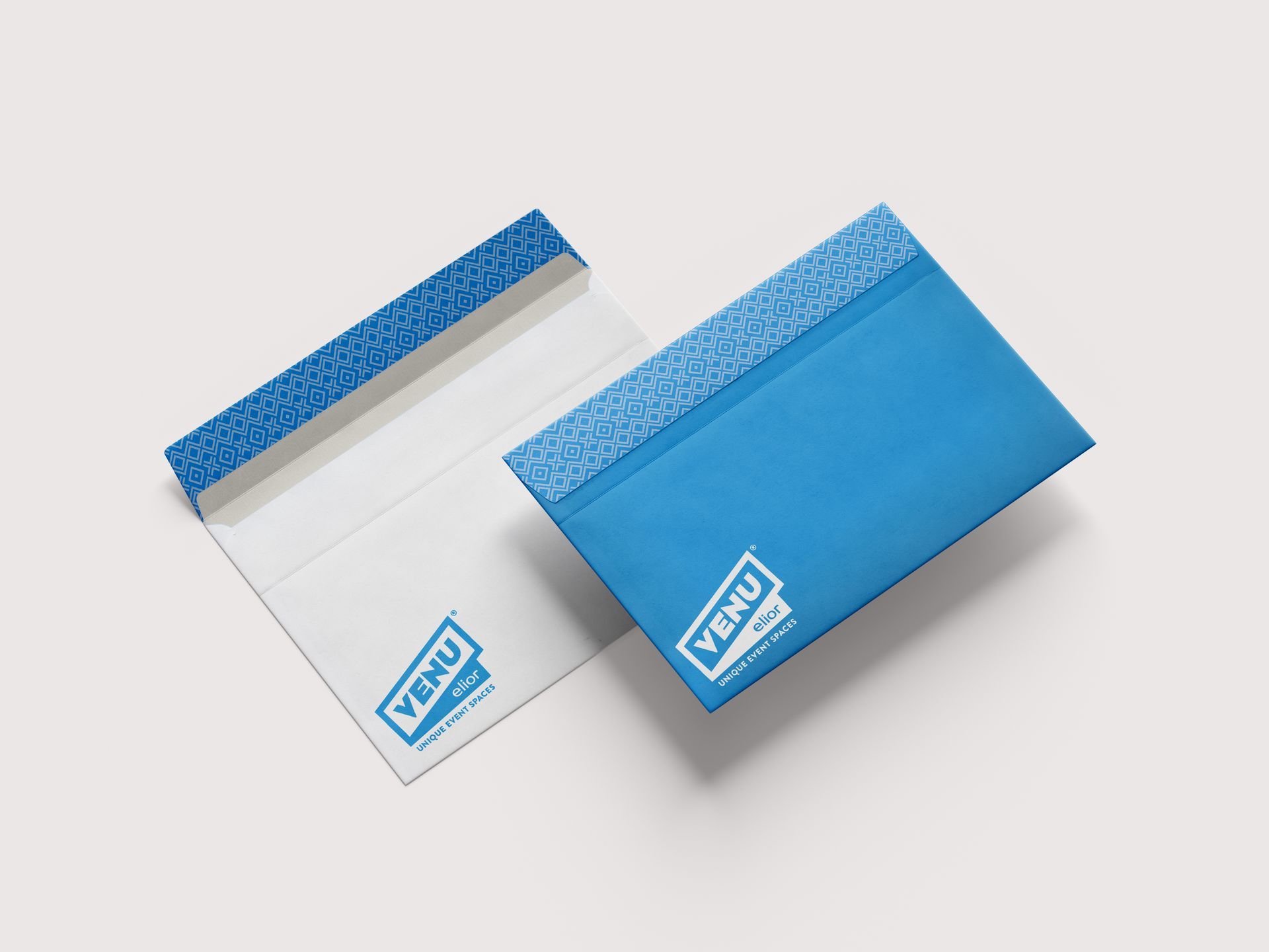 Two blue-and-white Zippo lighter boxes displayed on a light background