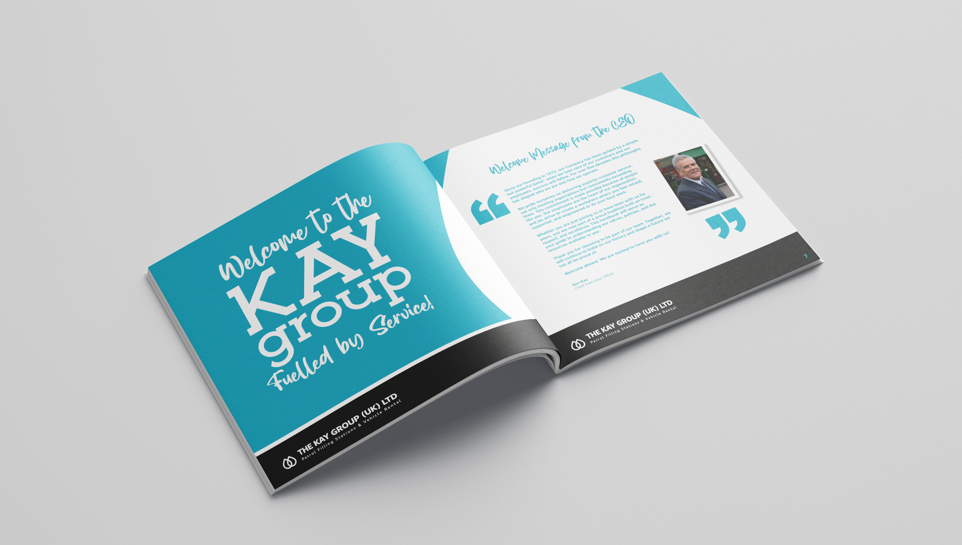 Open magazine spread with teal cover and white text on a gray background