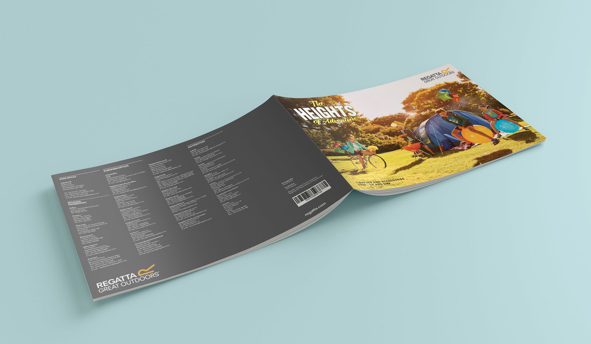 Open brochure with dark text pages and a bright autumn landscape photo on the right page