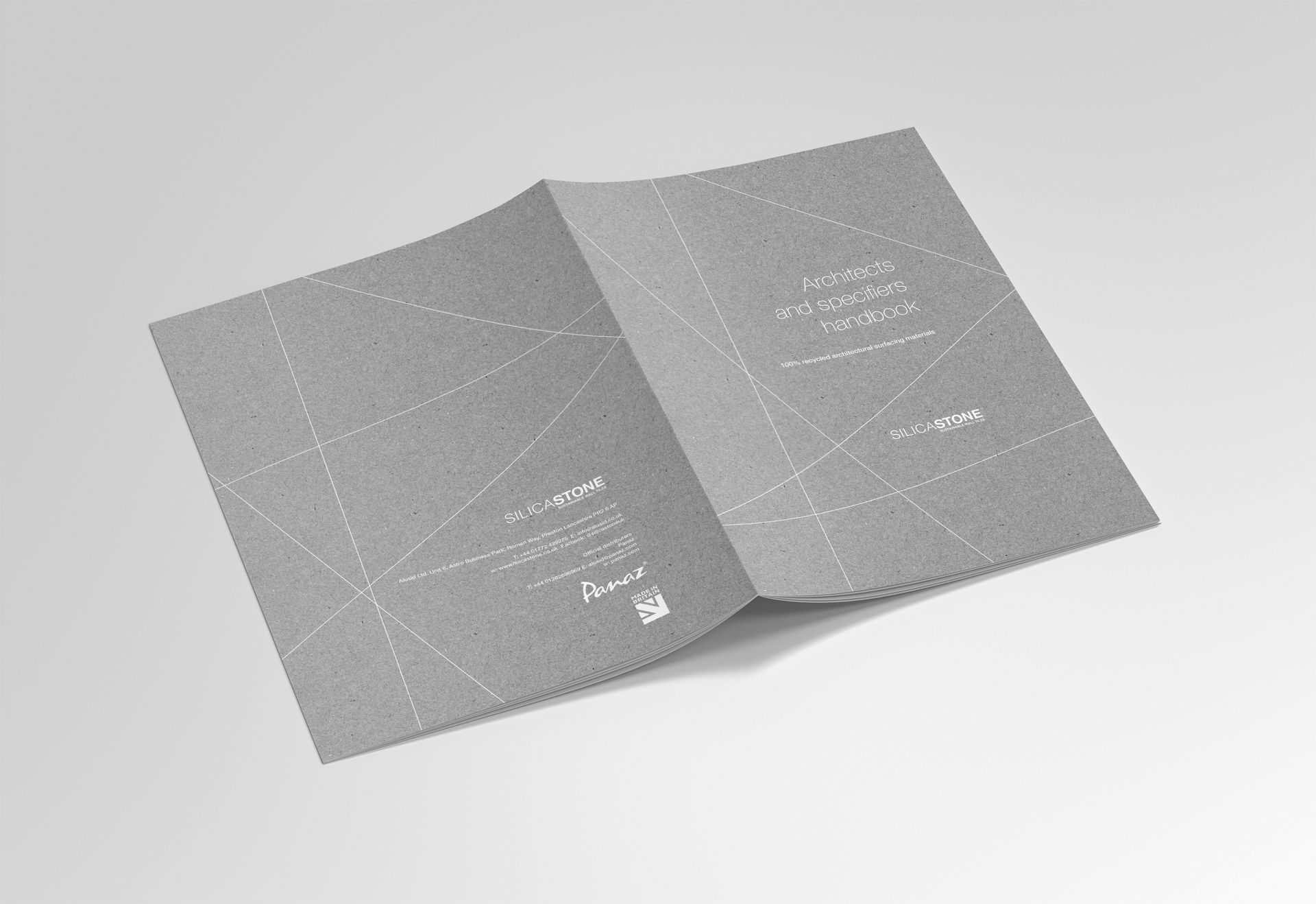 Open gray booklet with a speckled cover on a white background