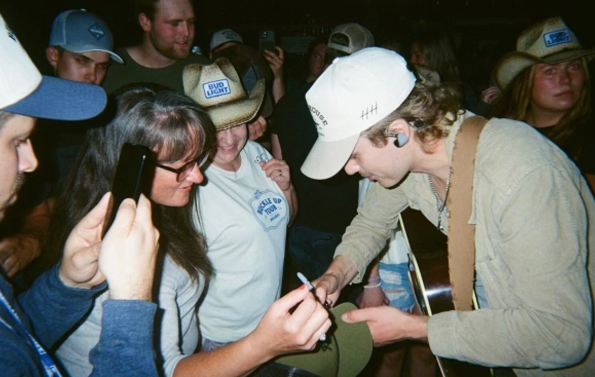 Owen Riegling signing fan autographs
