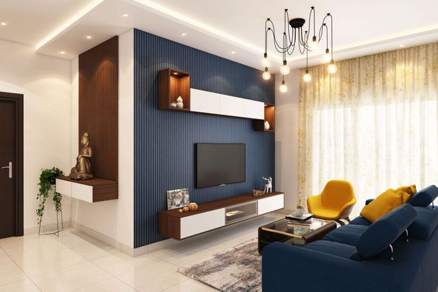 Modern living room with navy accent wall, yellow chair, blue sofa, and hanging chandelier lights Modern living room with navy accent wall, yellow chair, blue sofa, and hanging chandelier lights