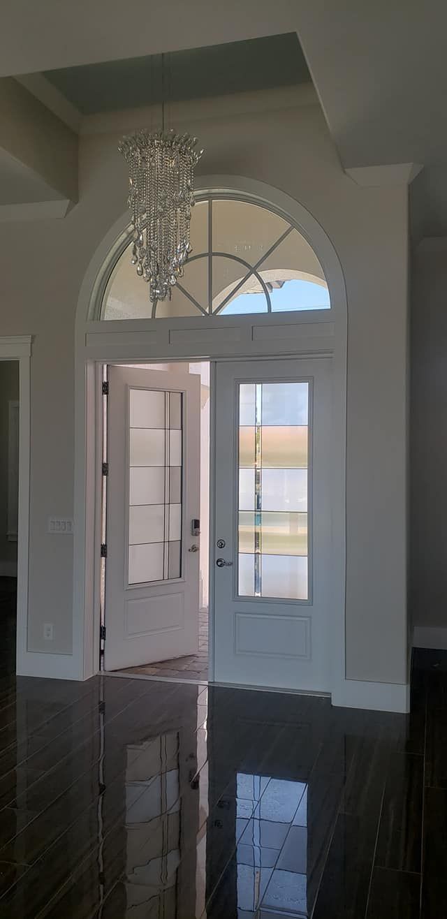 modern house interior with elegant double door and a chandelier