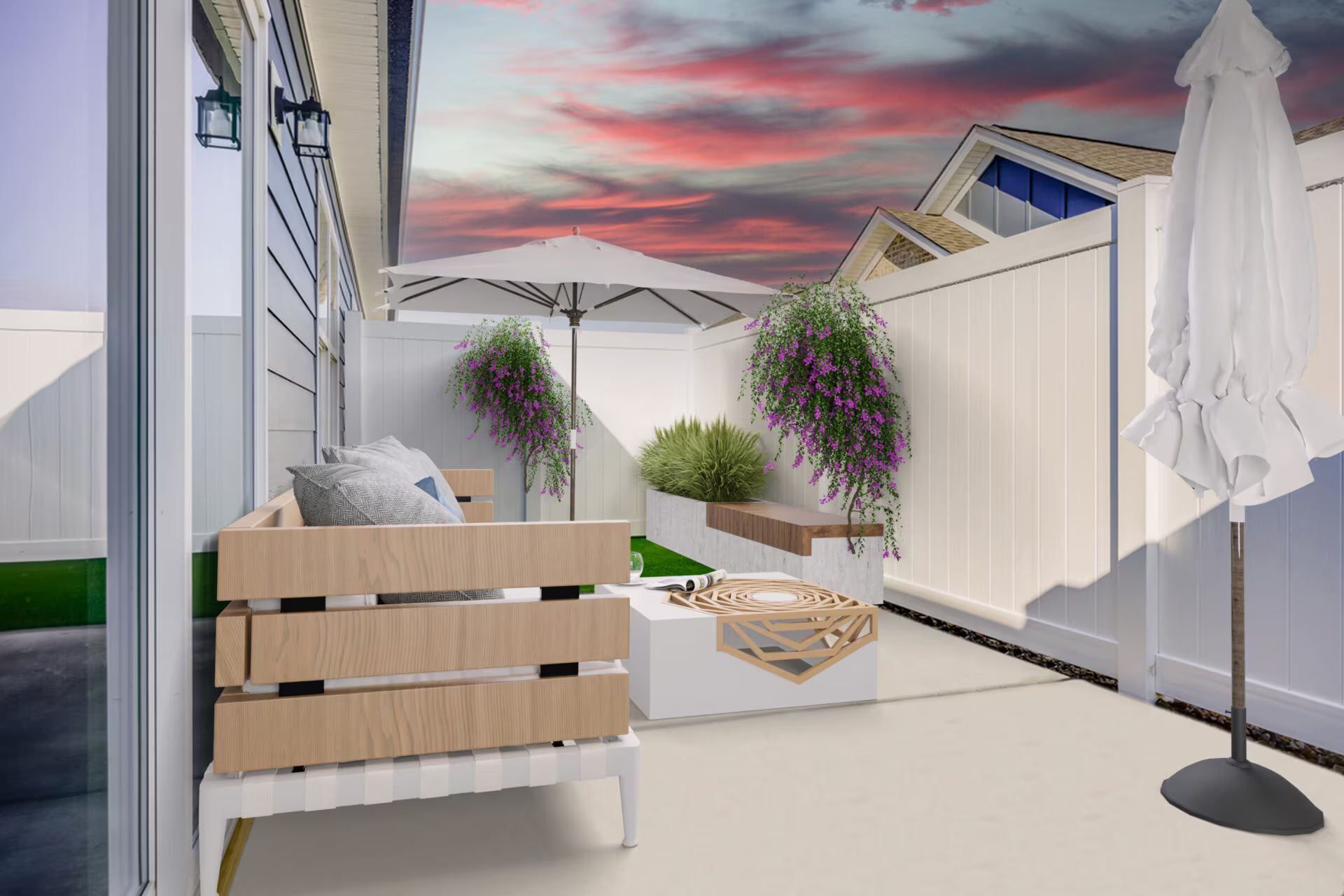 A patio with a couch , table , umbrella and flowers.
