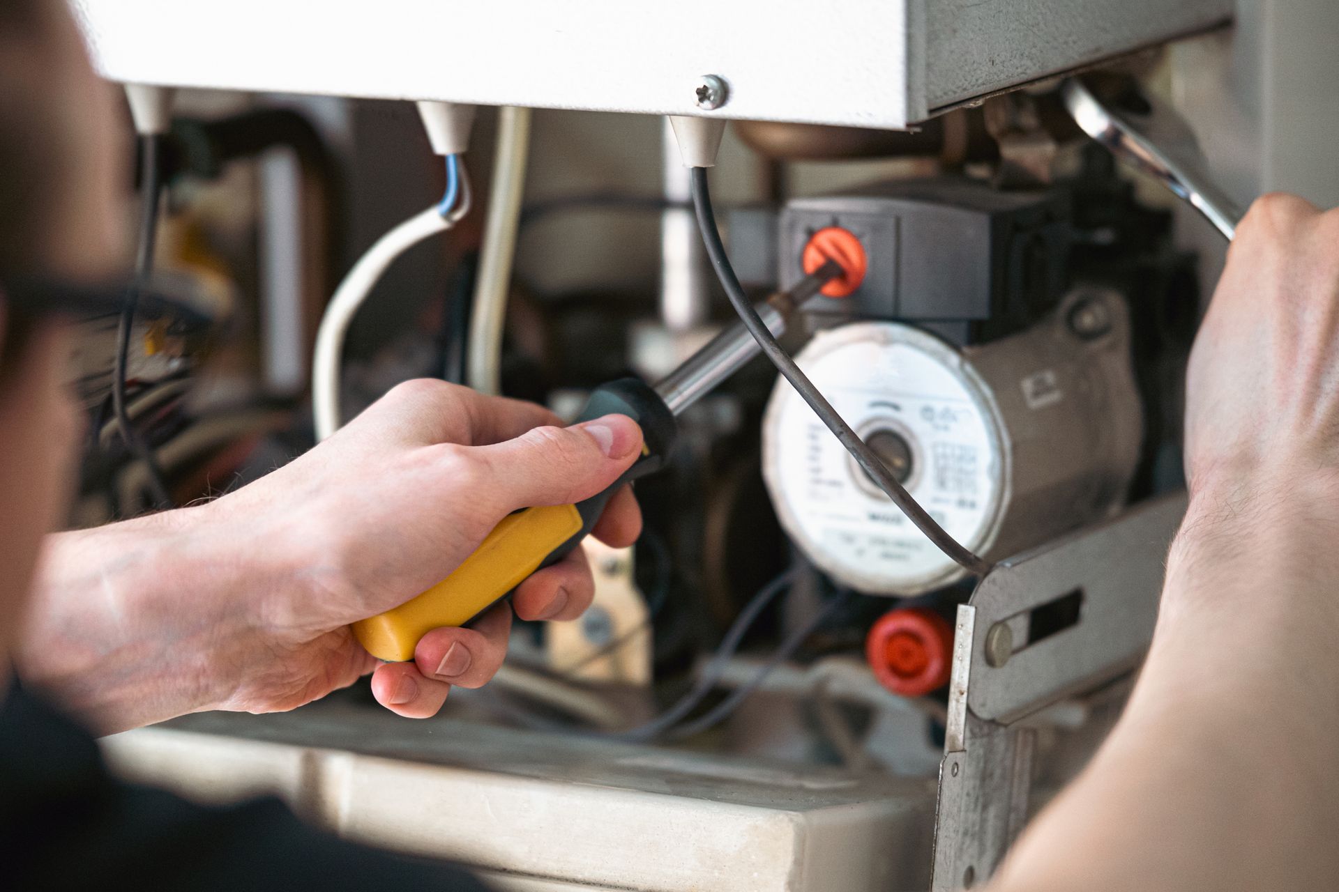 Repairing a gas furnace. Repairing a gas furnace.
