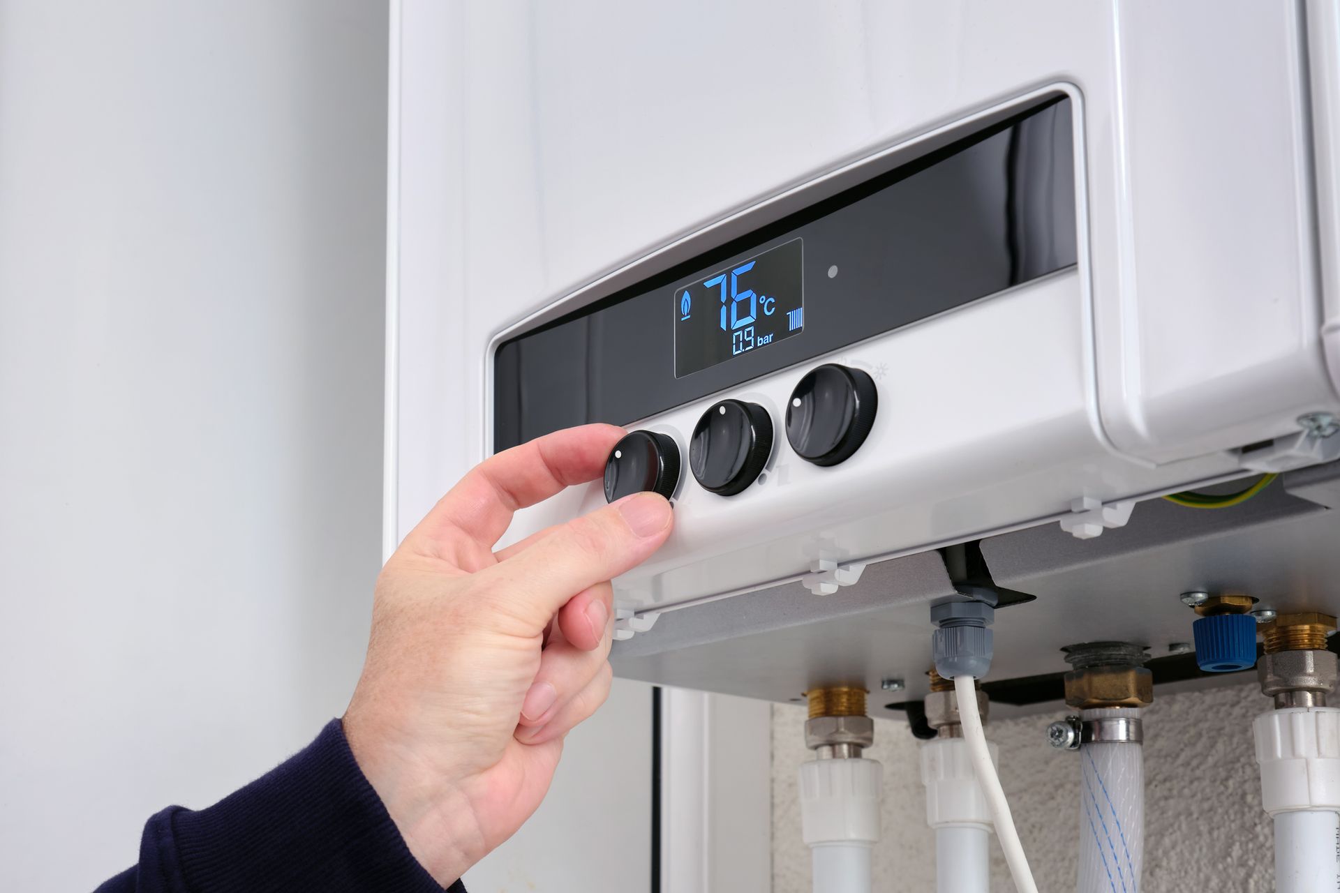 Adjusting a gas boiler.