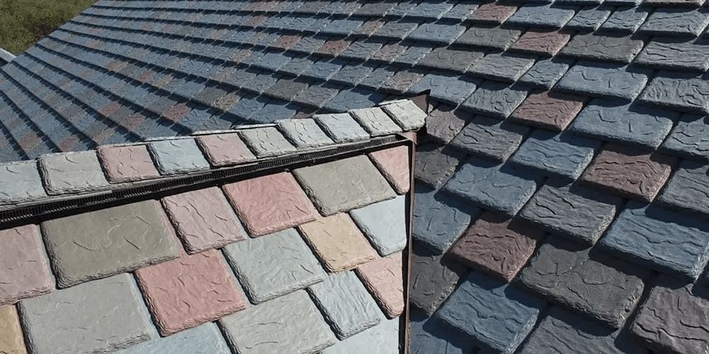 Colorful tiled roof with a sloping ridge and overlapping gray and red shingles
