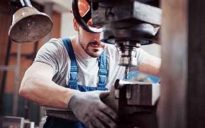 A man is working on a machine in a factory — Line Boring in Chevallum, QLD