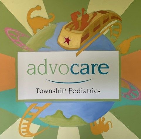 A sign that says advocare township pediatrics on it