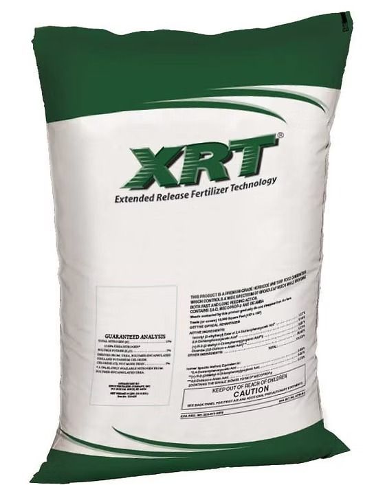 Green-and-white XRT extended-release fertilizer bag on a plain background