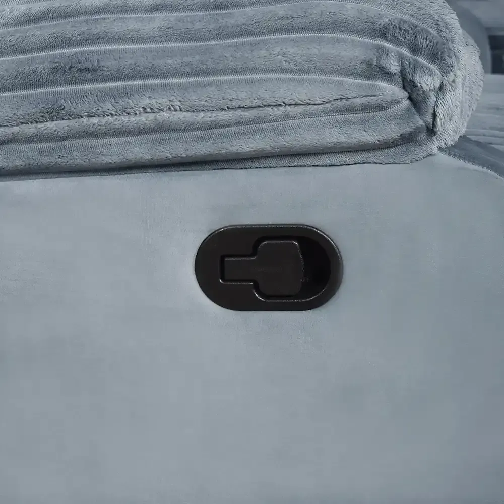 Close-up of a gray bag with a black zipper clasp near the top.