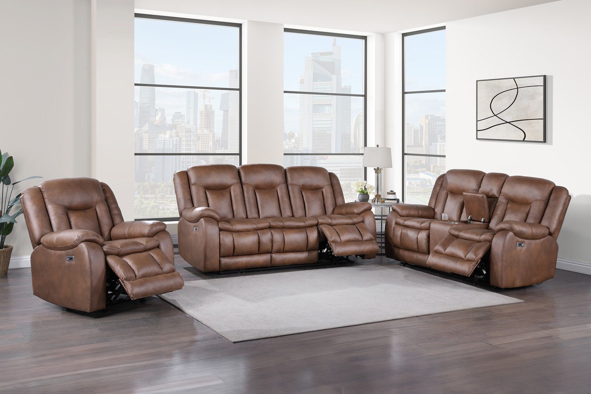 Brown leather reclining sofa set in a bright modern living room with large windows and city view