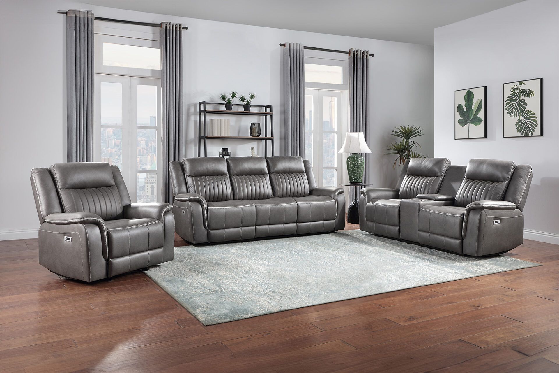 Modern living room with gray leather sofa set, recliner, light rug, and hardwood floors