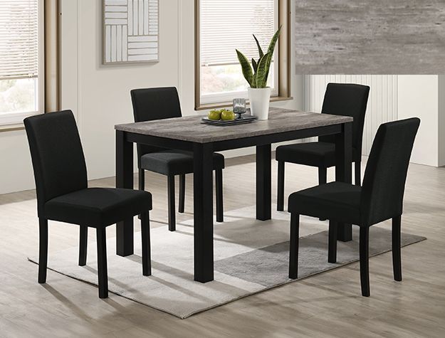 Black dining set with four chairs and a table in a bright modern room