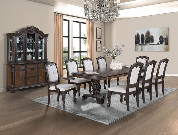 Elegant dining room with dark wood table, chairs, china cabinet, chandelier, and landscape art.
