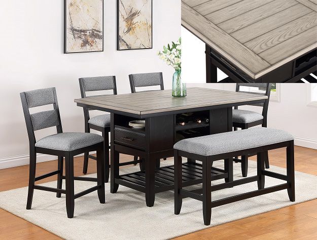 Dark wood dining table with six gray upholstered chairs in a bright room