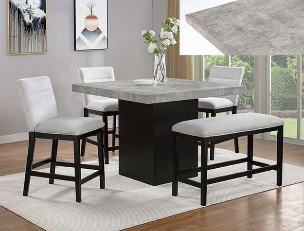 Modern dining set with gray table, white chairs, and black bench in a bright room