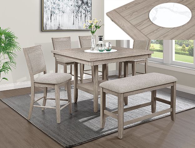 Modern dining set with four beige upholstered chairs around a wooden table on a gray rug in a bright room