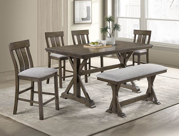 Rustic wooden dining set with table, four chairs, and bench on a light rug in a bright room