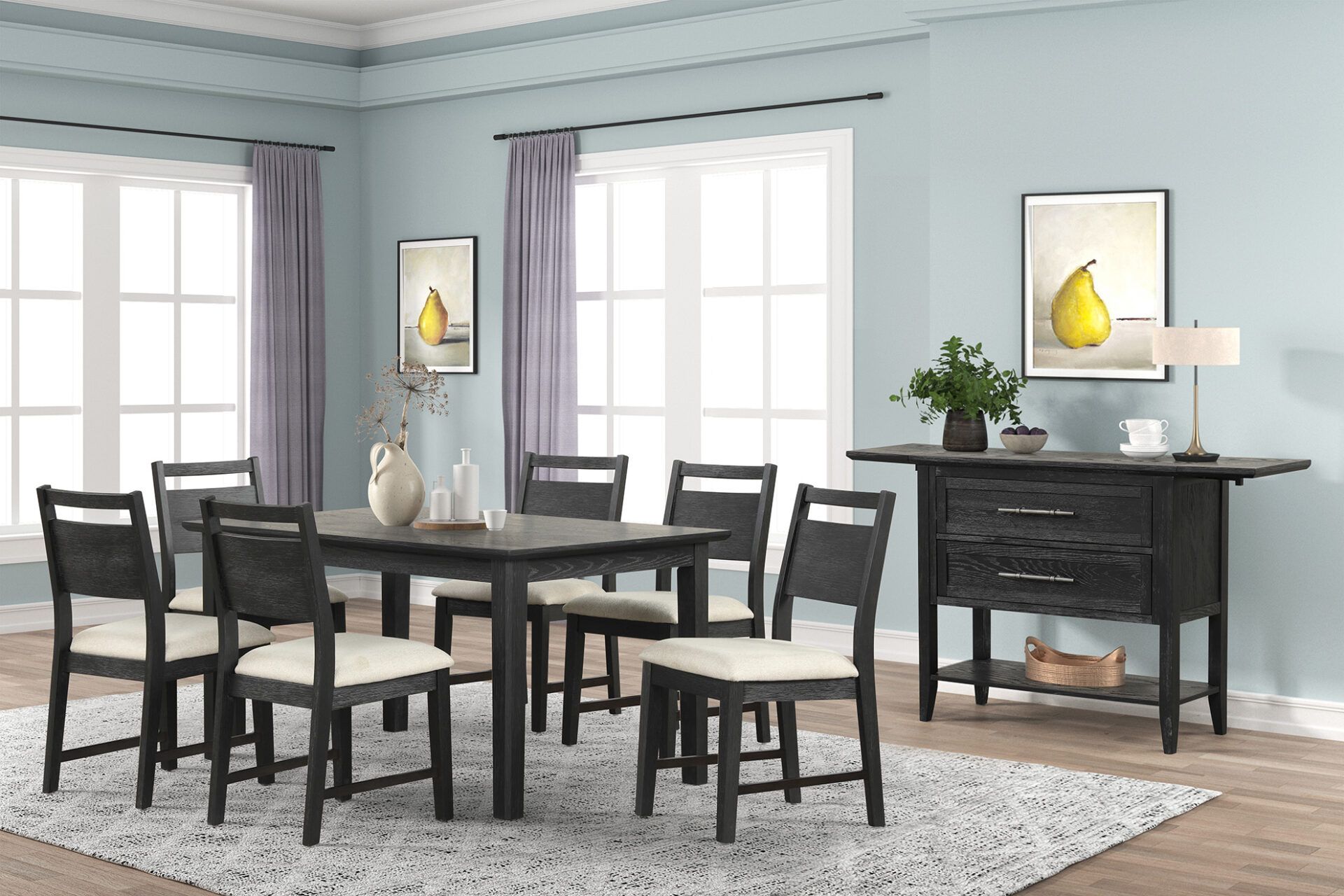 Dining room with black table and chairs, pale blue walls, two windows, and dark sideboard with decor