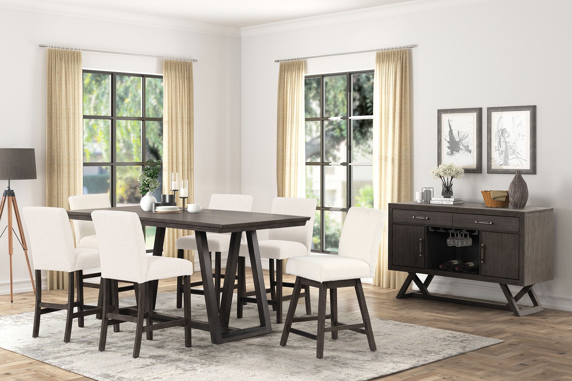Bright dining room with black table, white chairs, large windows, and a dark sideboard with decor