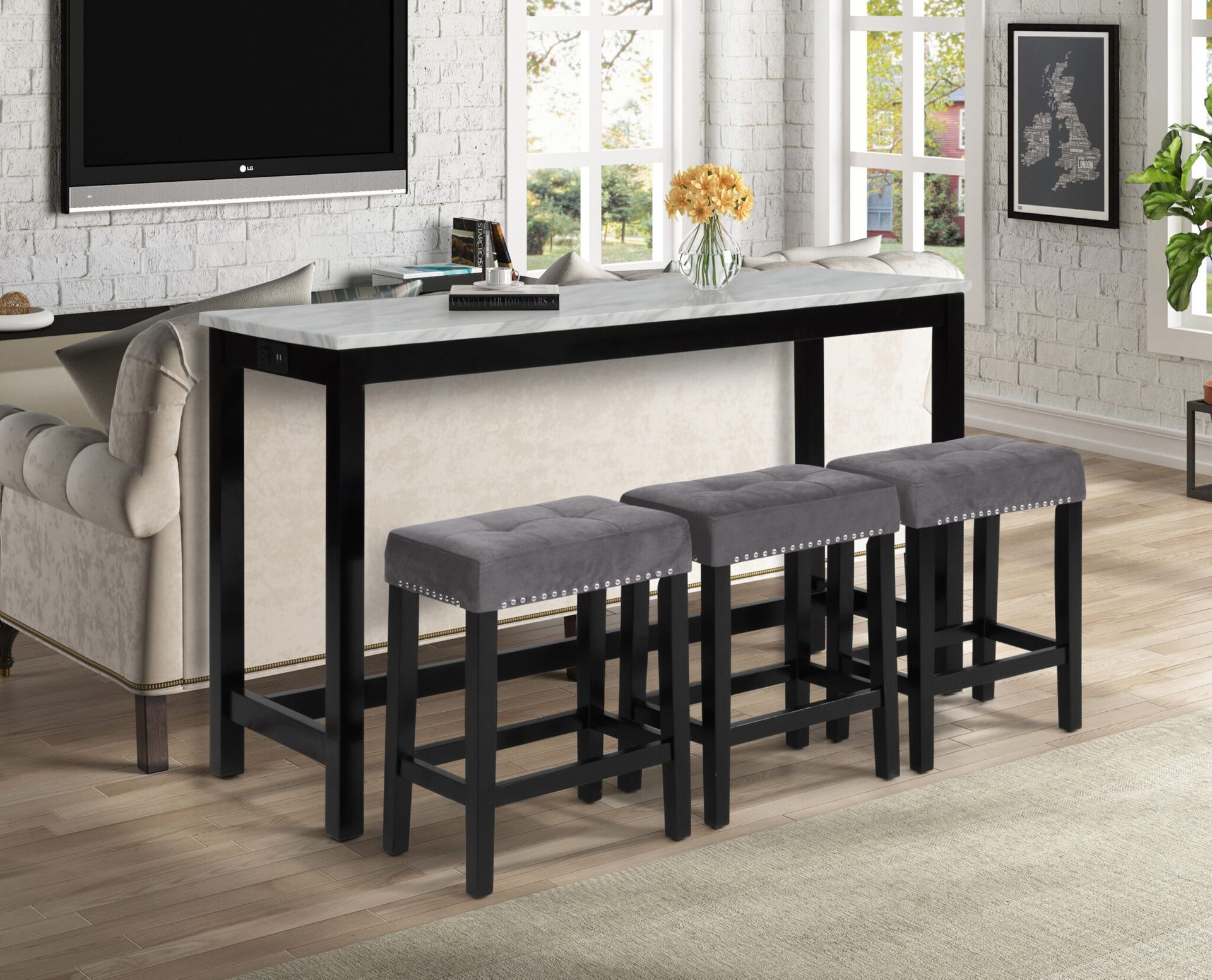 Modern kitchen dining set with black table, four gray stools, and light decor in a bright room