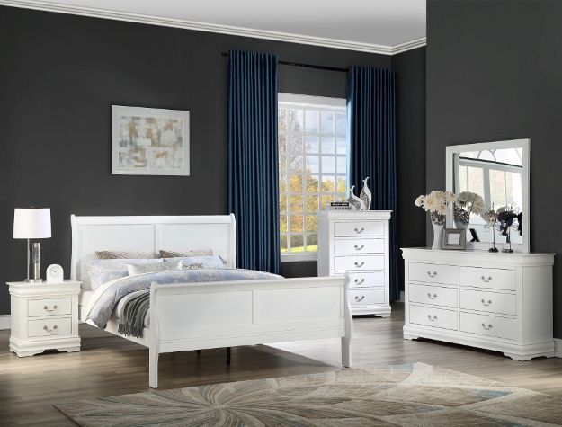 Modern bedroom with white furniture, dark walls, blue curtains, and a patterned rug