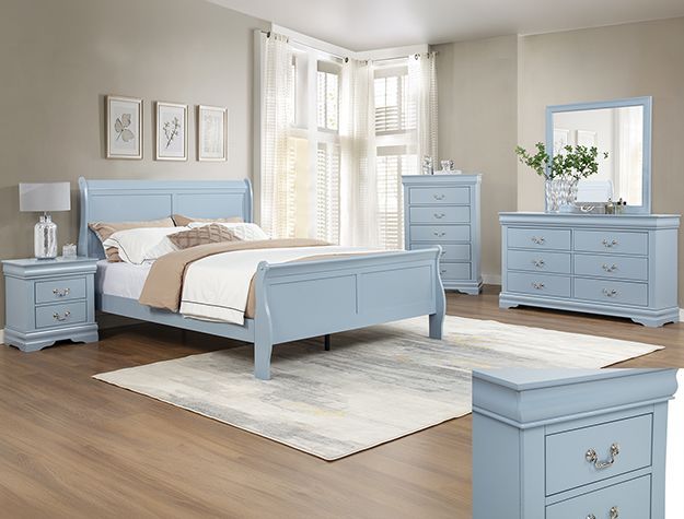Light blue bedroom set with bed, dresser, nightstand, and mirror on a white rug