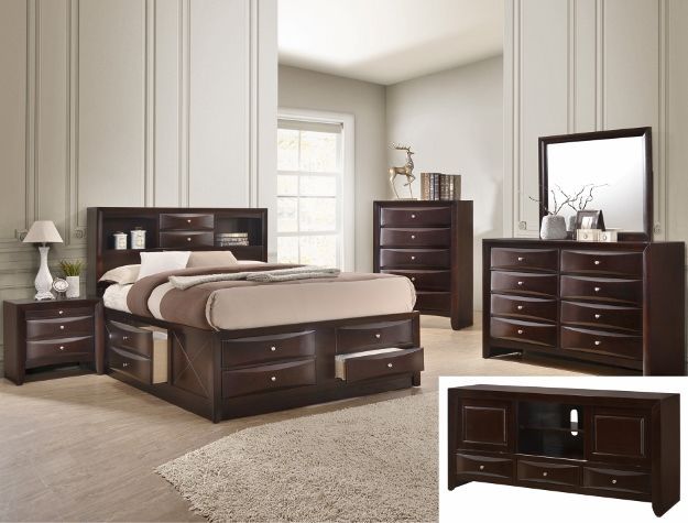 Dark wood bedroom furniture set with bed, nightstands, dresser, mirror, and TV stand in a bright room