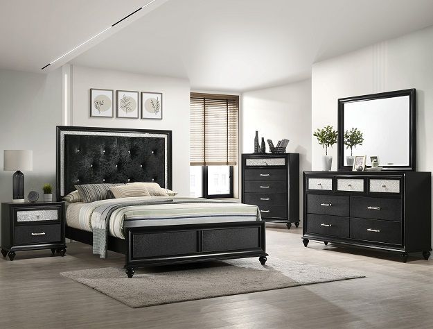 Modern black bedroom set with tufted bed, dresser, nightstand, mirror, and neutral decor