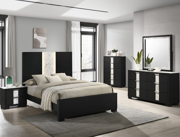 Modern gray bedroom with black bed, dresser, nightstand, mirror, and window light