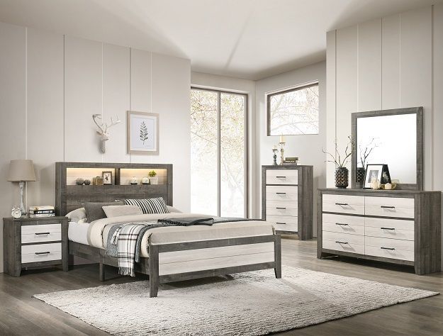 Modern gray and white bedroom with bed, nightstands, dresser, mirror, and a bench on a light rug