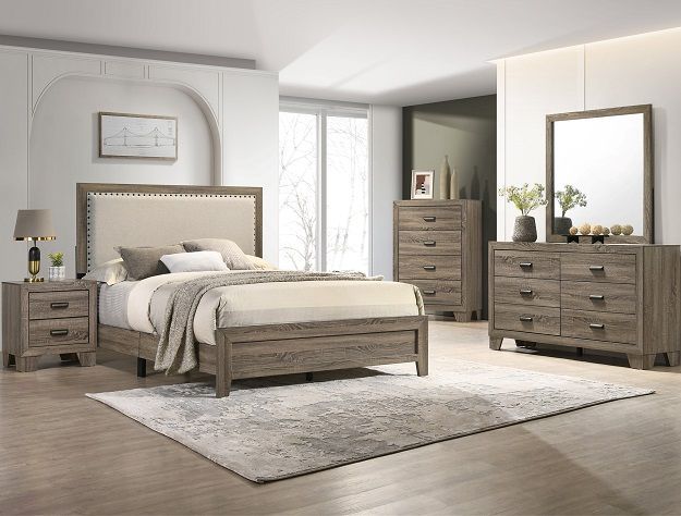 Modern bedroom set with upholstered bed, matching dresser, nightstand, and mirror in a bright neutral room