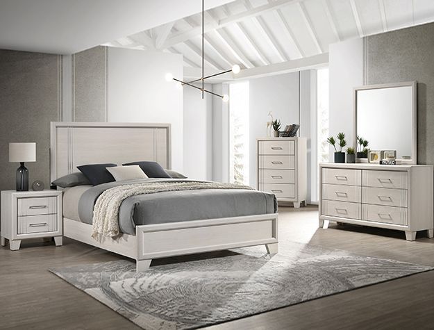Modern white bedroom with upholstered bed, dresser, nightstand, mirror, and gray rug