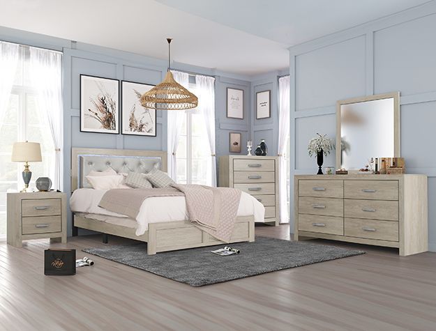 Bright modern bedroom with white bed, gray dresser, bedside tables, and woven pendant light