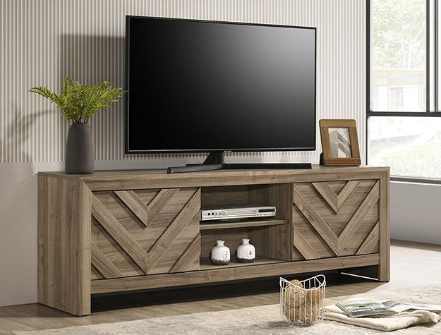Modern rustic TV stand with diagonal wood doors, a flat-screen TV, plant, and framed photo in a bright living room