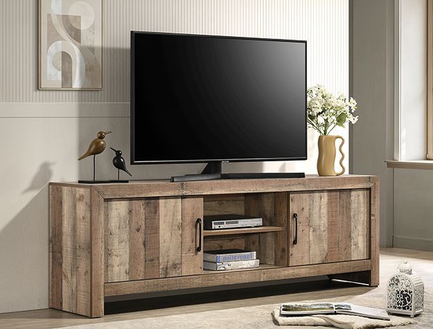 Rustic wood TV console with a flat-screen TV, decorative bird, vase, and small shelf in a bright living room