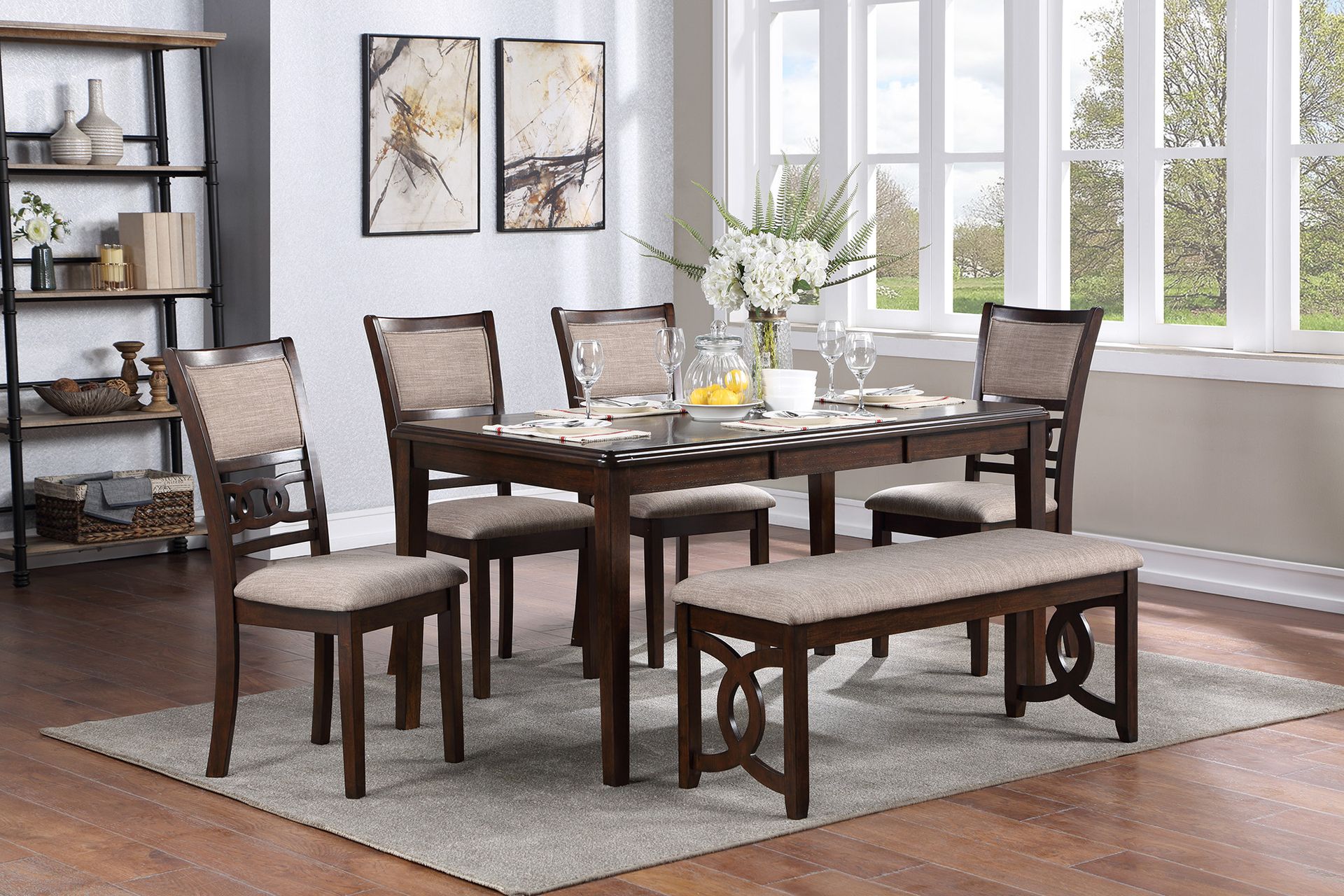 Dining room with a dark wood table, six chairs, bench, rug, wall art, and bright windows