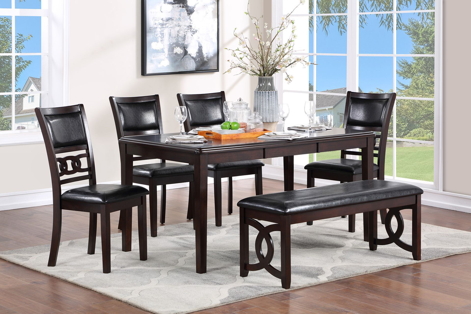 Dining room with dark wood table, four chairs, and a matching bench by bright windows
