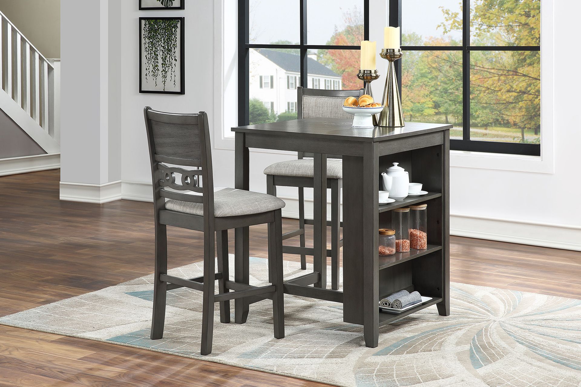 Small dark wood dining set with two chairs and a compact table on a light rug by a window.