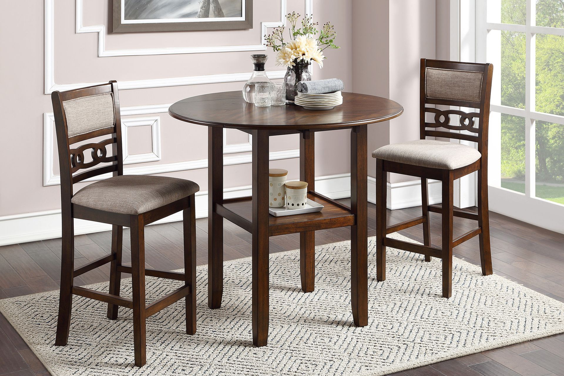 Round dark-wood pub table with two matching chairs on a light rug in a bright room