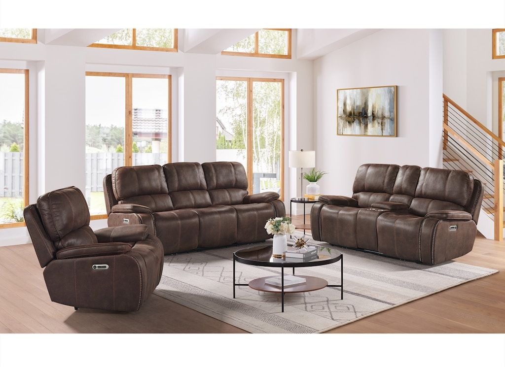Brown leather living room furniture set with recliners around a glass coffee table in a bright modern room