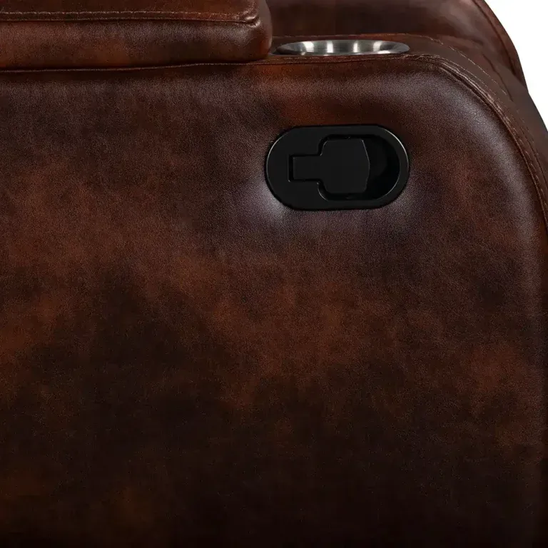 Close-up of a brown leather seat with a black control switch and a silver cup holder