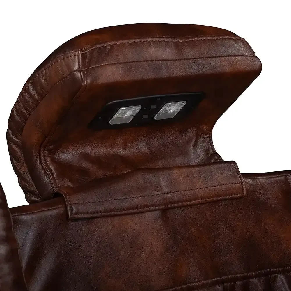 Brown leather jacket collar with an inner black label panel and metal snaps