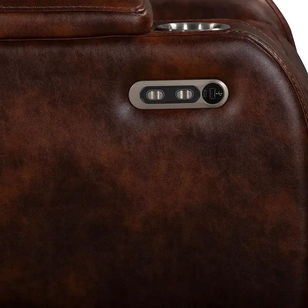 Close-up of a brown leather massage chair side panel with control buttons